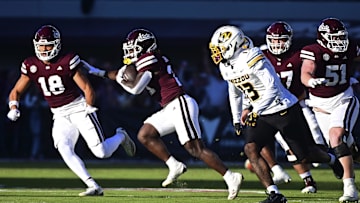 Nov 23, 2024; Starkville, Mississippi, USA; Mississippi State Bulldogs running back Davon Booth (21) runs against the Missouri Tigers during the first quarter at Davis Wade Stadium at Scott Field. Mandatory Credit: Matt Bush-Imagn Images