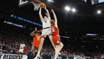 Mar 30, 2024; Boston, MA, USA; Connecticut Huskies center Donovan Clingan (32) shoots the ball over the Illinois defenders in the Elite Eight on the NCAA Tournament.