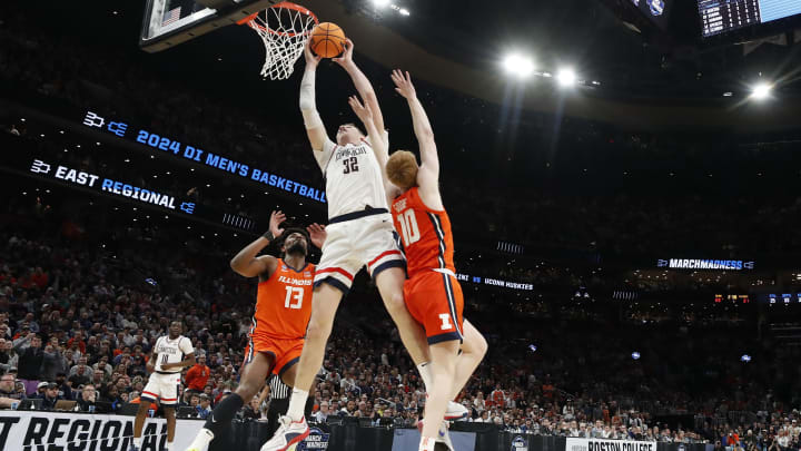 Mar 30, 2024; Boston, MA, USA; Connecticut Huskies center Donovan Clingan (32) shoots the ball over the Illinois defenders in the Elite Eight on the NCAA Tournament.