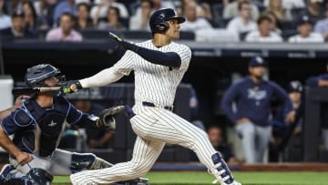 Jul 19, 2024; Bronx, New York, USA;  New York Yankees right fielder Juan Soto (22) hits a double in the fourth inning against the Tampa Bay Rays at Yankee Stadium. Mandatory Credit: Wendell Cruz-USA TODAY Sports