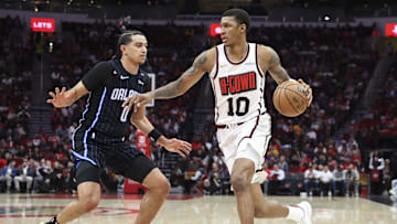 Mar 10, 2025; Houston, Texas, USA; Houston Rockets forward Jabari Smith Jr. (10) dribbles the ball as Orlando Magic guard Anthony Black (0) defends during the second quarter at Toyota Center. Mandatory Credit: Troy Taormina-Imagn Images