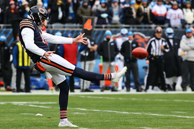 hicago Bears punter Tory Taylor (19) punts the ball to the Detroit Lions during the first quarter at Soldier Field.