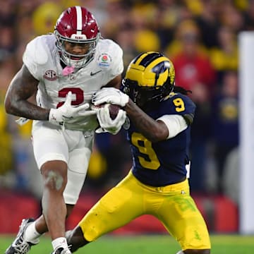  Alabama Crimson Tide running back Jase McClellan (2) runs against Michigan Wolverines defensive back Rod Moore (9)l. Mandatory Credit: Gary A. Vasquez-Imagn Images