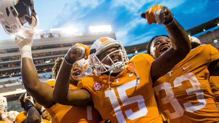 Tennessee offensive lineman K'Rojhn Calbert (74), Tennessee wide receiver Jauan Jennings (15) and Tennessee running back Jeremy Banks (33) celebrate the Tennessee Volunteers' 59-3 victory against ETSU in Neyland Stadium on Saturday, Sept. 8, 2018.