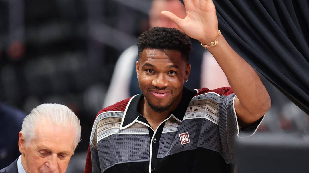 Jul 16, 2026; Miami, FL, USA; Miami Heat forward Giannis Antetokounmpo (7) waves to the crowd as he arrives with Miami Heat president Pat Riley to his introductory press conference at Kaseya Center. Mandatory Credit: Sam Navarro-Imagn Images