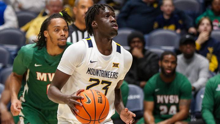 Dec 22, 2025; Morgantown, West Virginia, USA; West Virginia Mountaineers guard Morris Ugusuk (23) dribbles the ball during the first half against the Mississippi Valley State Delta Devils at Hope Coliseum. Mandatory Credit: Ben Queen-Imagn Images