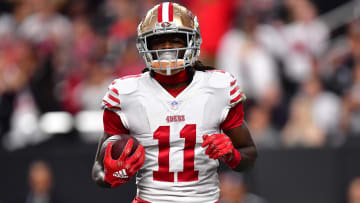 January 1, 2023; Paradise, Nevada, USA; San Francisco 49ers wide receiver Brandon Aiyuk (11) scores a touchdown against the Las Vegas Raiders during the first half at Allegiant Stadium. Mandatory Credit: Gary A. Vasquez-USA TODAY Sports