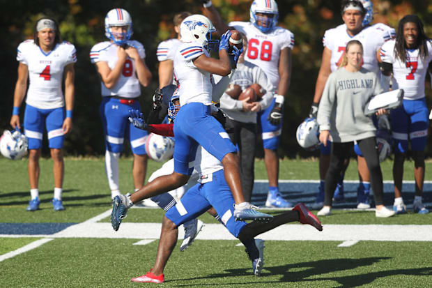 Hutchinson Blue Dragons defensive back DeShon Singleton intercepts a pass Saturday, Oct. 16, 2021 against Highland.