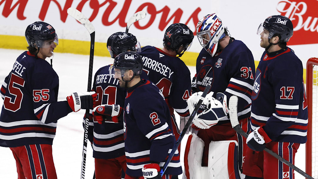 Mar 14, 2026; Winnipeg, Manitoba, CAN; Winnipeg Jets players celebrate their victory against the Colorado Avalanche at Canada Life Centre. Mandatory Credit: James Carey Lauder-Imagn Images