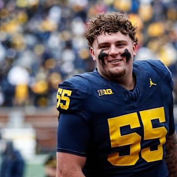 Blue Team defensive lineman Mason Graham (55) walks up the tunnel for halftime during the spring game at Michigan Stadium in Ann Arbor on Saturday, April 20, 2024.