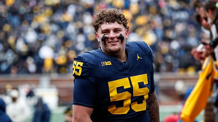 Blue Team defensive lineman Mason Graham (55) walks up the tunnel for halftime during the spring game at Michigan Stadium in Ann Arbor on Saturday, April 20, 2024.