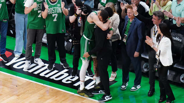 Tatum celebrates with Mazzulla after defeating the Mavericks in five games to win the championship.