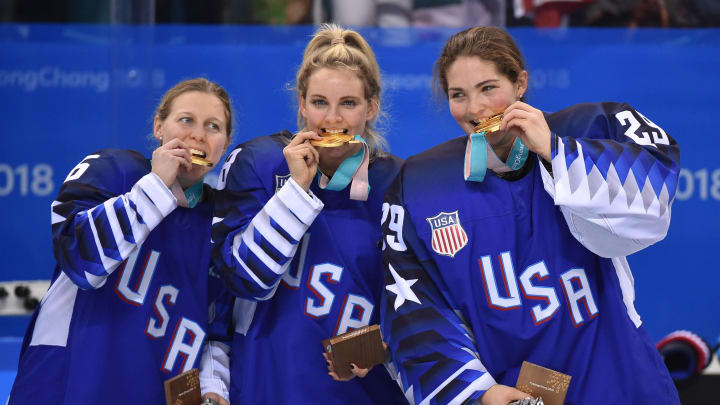 Feb 22, 2018; Gangneung, South Korea; United States players Kendall Coyne (26) , Amanda Kessel (28) and Nicole Hensley (29) celebrate with their gold medals after defeating Canada in the women's ice hockey gold medal match during the Pyeongchang 2018 Olympic Winter Games at Gangneung Hockey Centre. Mandatory Credit: Andrew Nelles-USA TODAY Sports