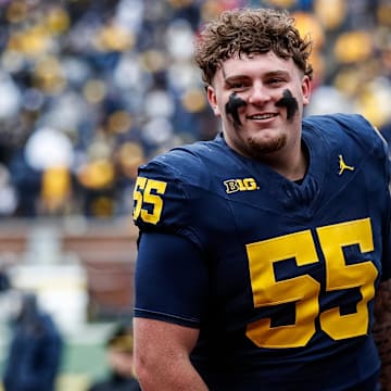 Blue Team defensive lineman Mason Graham (55) walks up the tunnel for halftime during the spring game at Michigan Stadium in Ann Arbor on Saturday, April 20, 2024.