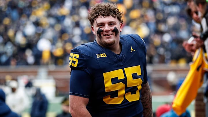 Blue Team defensive lineman Mason Graham (55) walks up the tunnel for halftime during the spring game at Michigan Stadium in Ann Arbor on Saturday, April 20, 2024.