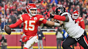 Dec 7, 2025; Kansas City, Missouri, USA; Kansas City Chiefs quarterback Patrick Mahomes (15) is pressured by Houston Texans defensive tackle Mario Edwards Jr. (97) during the second quarter at GEHA Field at Arrowhead Stadium.