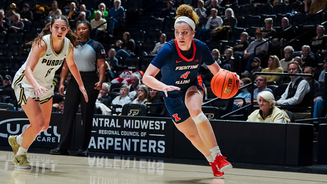 Illinois guard Gretchen Dolan (4) drives against a Purdue defender in the Illini's 83-73 win Sunday at Mackey Arena in West Lafayette, Indiana.