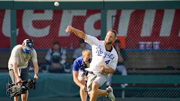 Jul 24, 2021; Kansas City, Missouri, USA;  Former Kansas City Royals left fielder Alex Gordon throws to home plate from left field during Alex Gordon Day ceremonies before the game against the Detroit Tigers at Kauffman Stadium. Mandatory Credit: Denny Medley-Imagn Images
