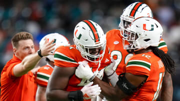 Oct 21, 2023; Miami Gardens, Florida, USA; Miami Hurricanes defensive lineman Rueben Bain Jr. (44) celebrates with team mates after sacking Clemson Tigers quarterback Cade Klubnik (2) (not pictured) during the second quarter at Hard Rock Stadium. Mandatory Credit: Rich Storry-USA TODAY Sports