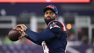 August 8, 2024; Foxborough, MA, USA;  New England Patriots quarterback Jacoby Brissett (14) tosses the ball on the sideline during the first half against the Carolina Panthers at Gillette Stadium. Mandatory Credit: Eric Canha-USA TODAY Sports