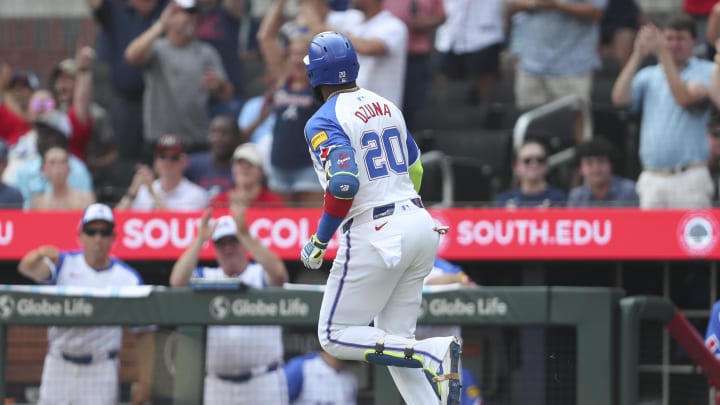 Jun 15, 2024; Cumberland, Georgia, USA; Atlanta Braves designated hitter Marcell Ozuna (20) hits a home run against the Tampa Bay Rays during the fifth inning at Truist Park. Mandatory Credit: Mady Mertens-USA TODAY Sports