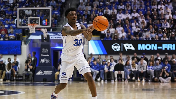 Mar 7, 2026; Provo, Utah, USA; BYU Cougars forward Kennard Davis Jr. (30) passes the ball during the first half against the Texas Tech Red Raiders at Marriott Center. Mandatory Credit: Aaron Baker-Imagn Images 