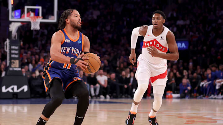 Jan 20, 2024; New York, New York, USA; New York Knicks guard Jalen Brunson (11) attempts a three point shot against Toronto Raptors guard RJ Barrett (9) during the first quarter at Madison Square Garden. Mandatory Credit: Brad Penner-Imagn Images