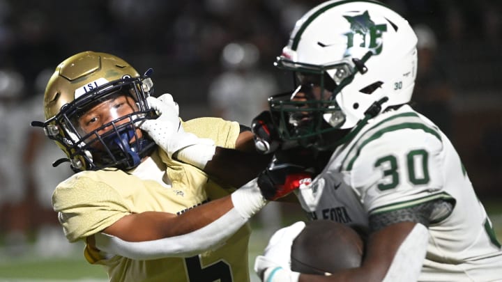 The Spartanburg Vikings played the Dutch Fork Silver Foxes in high school football at Spartanburg High School on Aug. 30, 2024. Spartanburg's Adrian Miller (6) fights Dutch Fork's Maurice Anderson (30) on a play. The Silver Foxes won, 24-7.