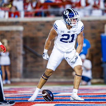 BYU running back Enoch Nawahine scores a touchdown against SMU