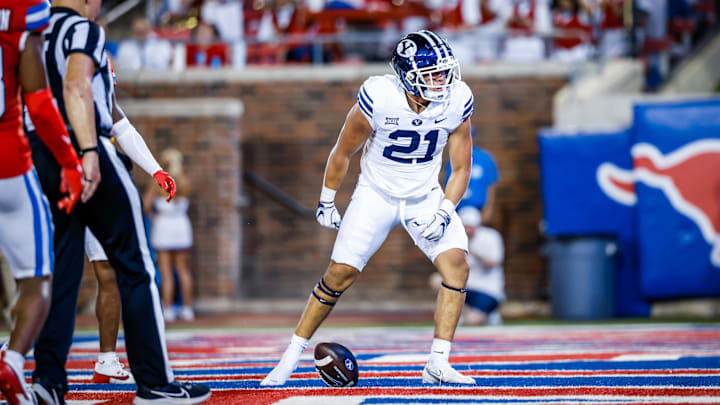 BYU running back Enoch Nawahine scores a touchdown against SMU