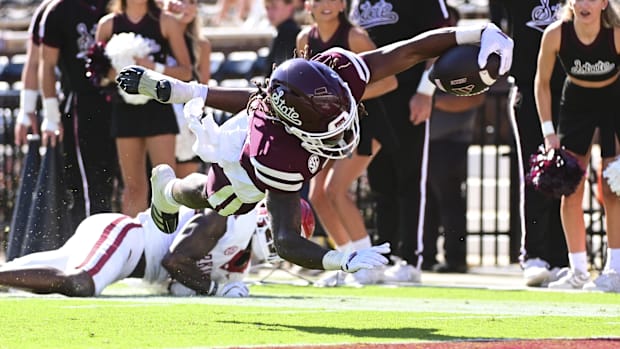 Mississippi State Bulldogs wide receiver Kevin Coleman Jr. (3) dives into the end zone against the Arkansas Razorbacks.