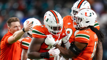 Oct 21, 2023; Miami Gardens, Florida, USA; Miami Hurricanes defensive lineman Rueben Bain Jr. (44) celebrates with team mates after sacking Clemson Tigers quarterback Cade Klubnik (2) (not pictured) during the second quarter at Hard Rock Stadium. Mandatory Credit: Rich Storry-USA TODAY Sports