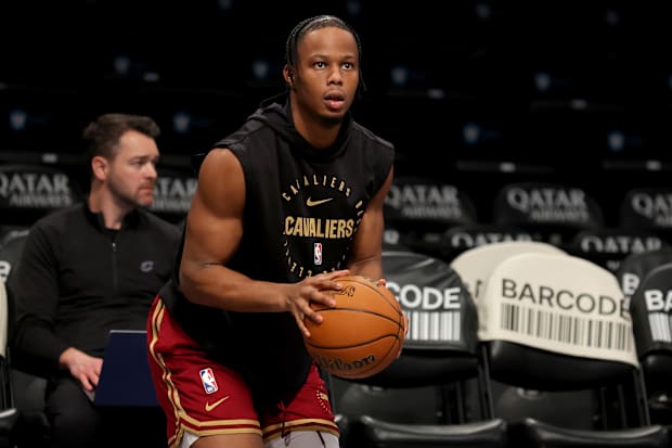 Isaac Okoro (35) warms up before a game