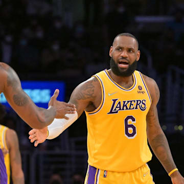 Jan 17, 2022; Los Angeles, California, USA;  Los Angeles Lakers center Dwight Howard (39) is met by Los Angeles Lakers forward LeBron James (6)  in the first half of the game against the Utah Jazz at Crypto.com Arena. Mandatory Credit: Jayne Kamin-Oncea-Imagn Images