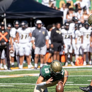 Paramus Catholic football at St. Joseph Regional, Saturday, Sept. 21, 2024, Montvale, New Jersey. Saint Joseph's #13 Michael Cevetillo holds the ball for kicker #45 Salvatore Salafia.