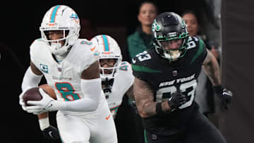 Jevon Holland of Miami returned this interception for a 100 yard TD in the first half as the Miami Dolphins defeated the NY Jets 34-13 at MetLife Stadium on November 24, 2023 in East Rutherford, NJ to play in the first Black Friday NFL game.