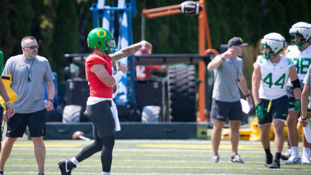 Oregon quarterback Dillon Gabriel throws the ball during practice with the Oregon Ducks 