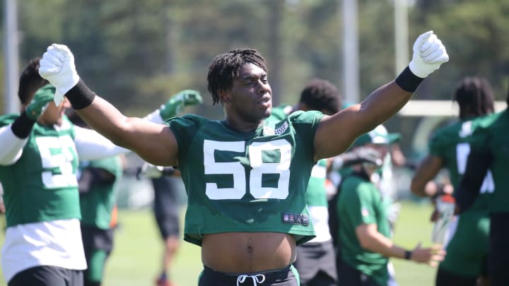 Defensive lineman Carl Lawson loosens up during the opening day of the 2022 New York Jets Training Camp in Florham Park, NJ on July 27, 2022.