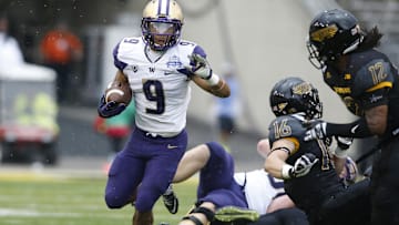 Dec 26, 2015; Dallas, TX, USA; Washington Huskies fullback Myles Gaskin (9) runs the ball in the third quarter against the Southern Miss Golden Eagles at Cotton Bowl Stadium. Gaskins was named most valuable player. Washington won 44-31. Mandatory Credit: Tim Heitman-Imagn Images