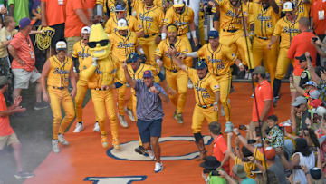 Clemson football Head Coach Dabo Swinney surprises the crowd, running down the hill ahead of the Savannah Bananas before a game before 81,000 fans with the Party Animals at Memorial Stadium in Clemson, S.C. Saturday, April 26, 2025.