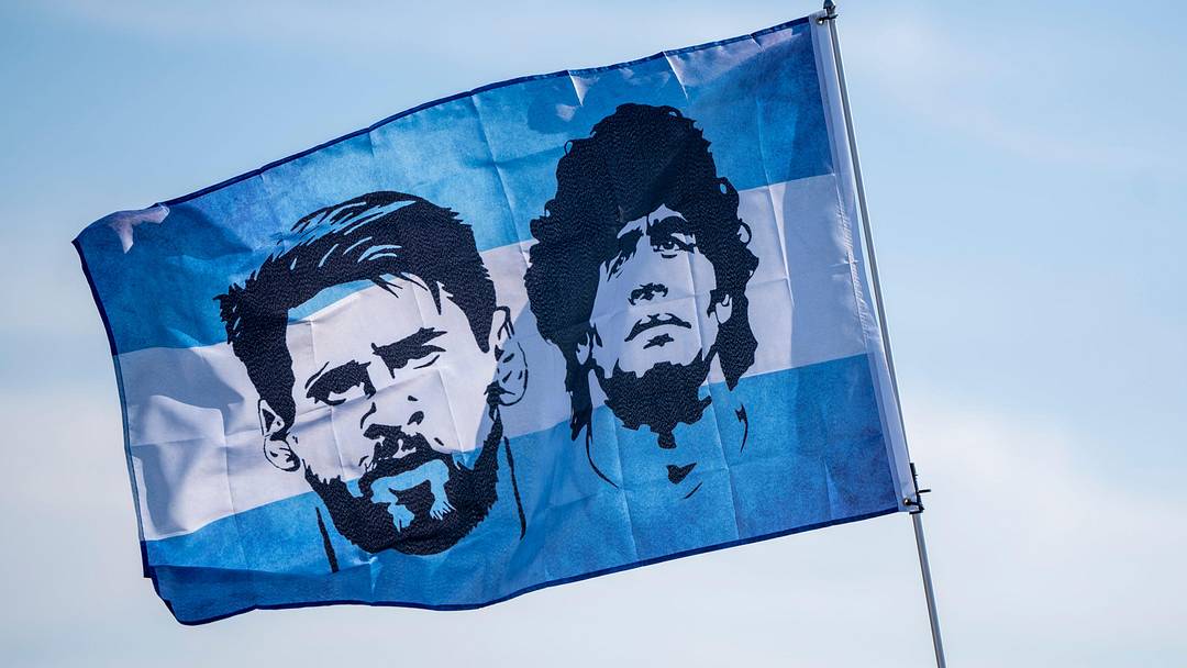 Jun 25, 2024; East Rutherford, NJ, USA; A flag with Argentina's Lionel Messi and Diego Maradona flies 