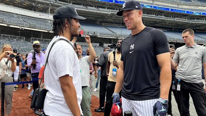New York Yankees center fielder Aaron Judge talks to New York Knicks guard Jalen Brunson before a game against the New York Mets at Yankee Stadium. New York Yankees center fielder Aaron Judge talks to New York Knicks guard Jalen Brunson before a game against the New York Mets at Yankee Stadium.