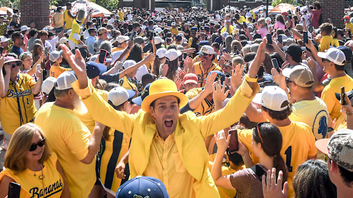 Jesse Cole, owner of the Savannah Bananas, leads the teams greeting fans at Tiger Walk, where players on the Savannah Bananas and Party Animals walked by cheering fans toward Memorial Stadium in Clemson, S.C. Saturday, April 26, 2025. The Bananas world tour stop in Clemson with 81,000 is the most fans they have played in front of, in a stadium normally used for Clemson Tigers football games.