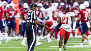 Dec 21, 2022; New Orleans, Louisiana, USA;  Western Kentucky Hilltoppers defensive back Upton Stout (21) reacts after intercepting a pass against the South Alabama Jaguars during the second half at Caesars Superdome. Mandatory Credit: Stephen Lew-Imagn Images