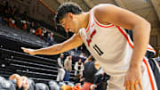Oregon State's Parsa Fallah (11) high-fives a young fan after defeating San Diego at Gill Coliseum on Saturday, Jan. 4, 2025, in Corvallis, Ore.