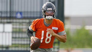 Jul 24, 2025; Lake Forest, IL, USA; Chicago Bears quarterback Caleb Williams (18) runs with the ball during training camp at Halas Hall. Mandatory Credit: Kamil Krzaczynski-Imagn Images