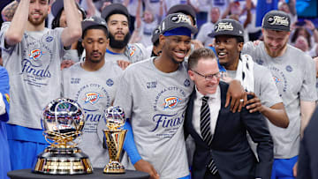 May 28, 2025; Oklahoma City, Oklahoma, USA; Oklahoma City Thunder guard Shai Gilgeous-Alexander hugs Oklahoma City Thunder executive vice president and general manager Sam Presti after their team defeated the Minnesota Timberwolves in game five of the western conference finals for the 2025 NBA Playoffs at Paycom Center. Mandatory Credit: Alonzo Adams-Imagn Images