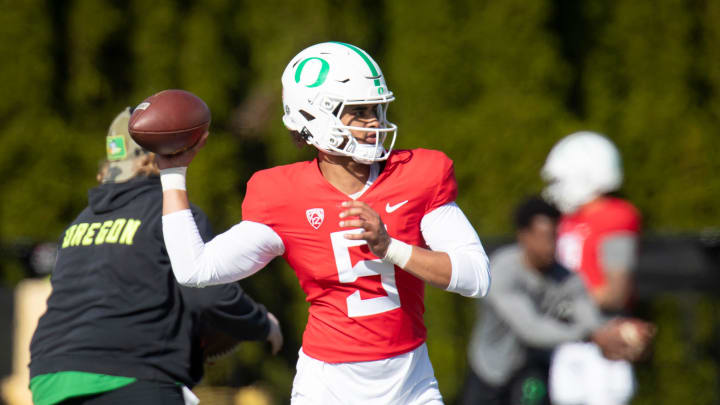 Oregon quarterback Dante Moore throws a pass during practice with the Ducks Tuesday, April 23, 2024 at the Hatfield-Dowlin Complex in Eugene, Ore.