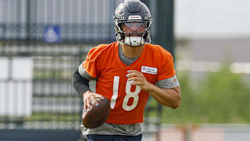 Jul 24, 2025; Lake Forest, IL, USA; Chicago Bears quarterback Caleb Williams (18) runs with the ball during training camp at Halas Hall. Mandatory Credit: Kamil Krzaczynski-Imagn Images