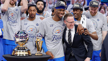 May 28, 2025; Oklahoma City, Oklahoma, USA; Oklahoma City Thunder guard Shai Gilgeous-Alexander hugs Oklahoma City Thunder executive vice president and general manager Sam Presti after their team defeated the Minnesota Timberwolves in game five of the western conference finals for the 2025 NBA Playoffs at Paycom Center. Mandatory Credit: Alonzo Adams-Imagn Images